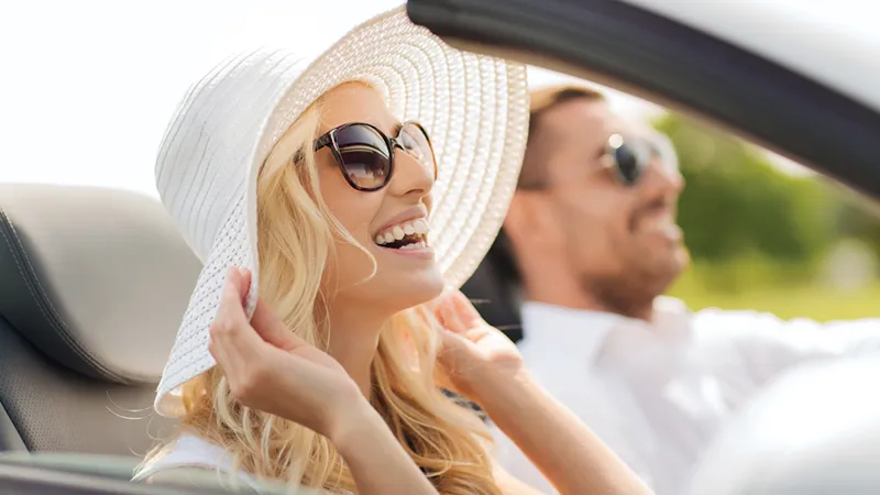 car-couple-laughing-soft-top